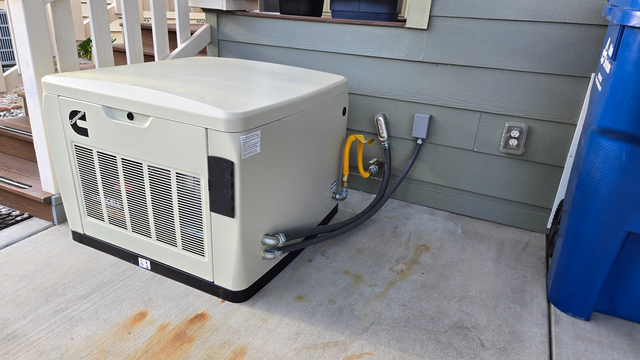 Residential backup generator installation with electrical connection